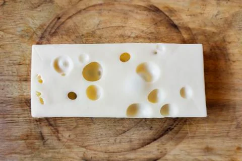 Cheese isolated on wood table Stock Photos