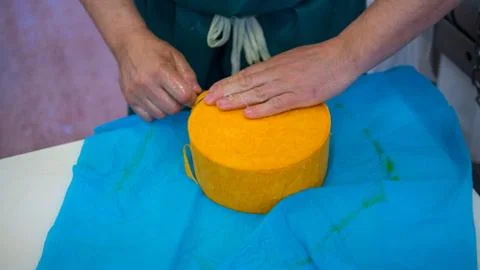Cheese maker preparing his next creation Stock Photos