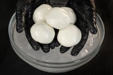 Cheese maker preparing mozzarella cheese Stock Photos