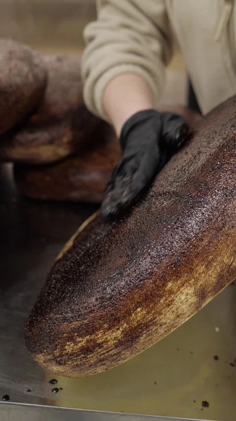 Cheese Maker Rubbing Dark Coating on Large Artisan Cheese Wheel Vidéo 342542137