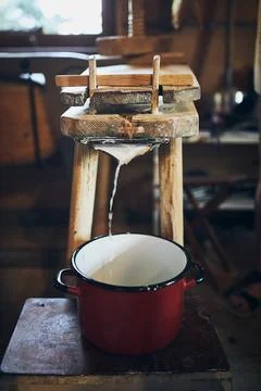 Cheese making. Making cottage cheese using cheese press and traditional old.. Stock Photos