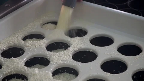 Cheese making process. Chees maker filling up a tray with cheese. Video stock 119772289