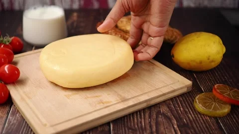 Cheese making process with milk and ingredients in kitchen Stock Footage 338041957