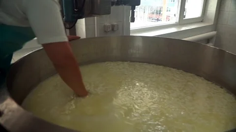 Cheese making process. Modern mixing tank for making cheese in slow motion. Stock Footage 119772257