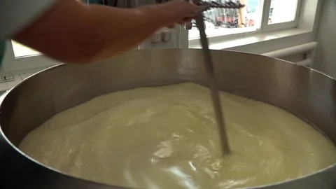 Cheese making process. Modern mixing tank for making cheese in slow motion. Stock Footage 119772266