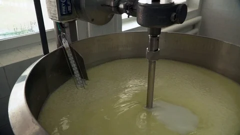 Cheese making process. Modern mixing tank for making cheese in slow motion. Video stock 119772267