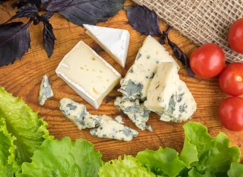 Cheese with Mold on Rustic Background Stock Photos