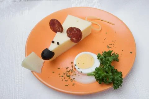 Cheese mouse with sausage and vegetal on the plate Stock Photos