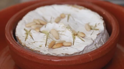 Cheese with nuts and honey on ceramic dish Stock Footage 102094025