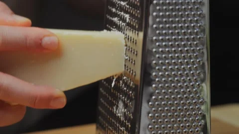 Cheese. Parmesan. Grate the cheese. Hard cheese. Cooking. Italian cuisine Stock Footage 270404285