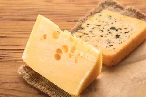 Cheese pieces closeup Stock Photos