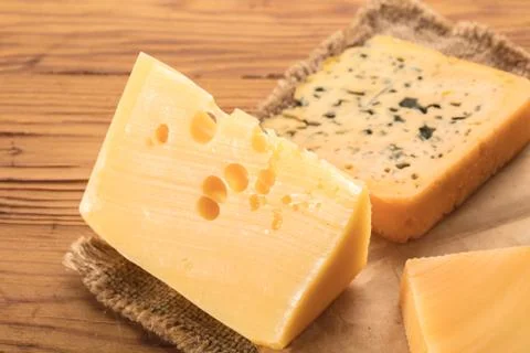 Cheese pieces closeup Stock Photos