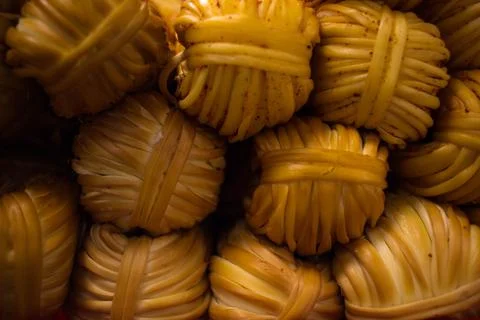 Cheese pigtail background texture. cheese pigtail lying slide. cheese pigtail Stock Photos