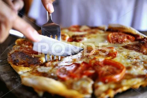 Cheese Pizza Being Sliced Stock Photos