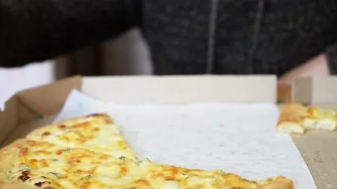 Cheese pizza, close-up arms of man taking slice of pizza. Hungry man . Fast food Stock Footage 221360084