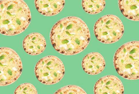 Cheese pizza pattern design on pale green background Stockfoto's