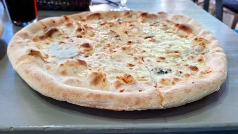 Cheese Pizza on Restaurant Table Freshly Baked Italian Classic Meal Stock Footage 338426562
