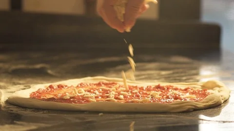 Cheese on Pizza slow motion Видео 105418602