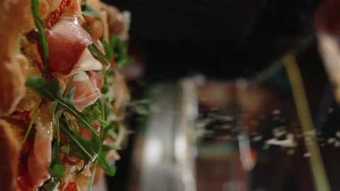 Cheese on pizza.Slow motion. 120 fps. Vertical video Stock Footage 172440113