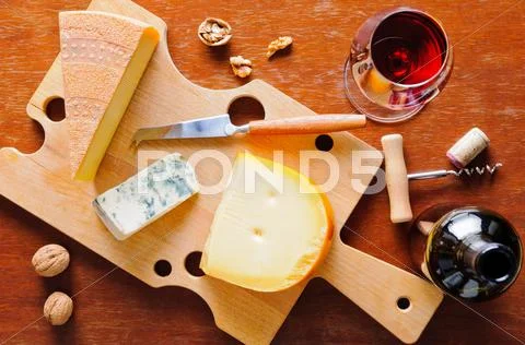Cheese plate and red wine Stock Photos