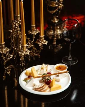 Cheese plate with crackers Stock Photos