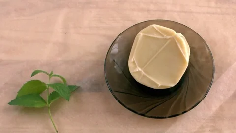 Cheese on a plate. Stock Footage 69075399