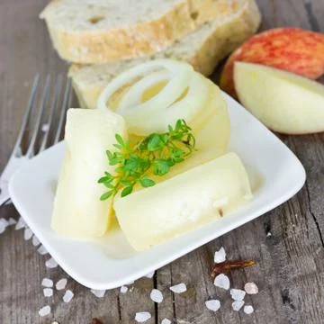 Cheese on plate Stock Photos