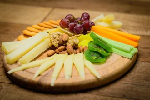 Cheese Platter with 4 types of cheese, quince paste, seedless grapes, carrot, Stock Photos