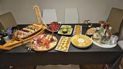 Cheese platter and bite size foods including sushi bar Stock Photos