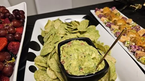 Cheese platter and bite size foods including sushi bar Stock Photos
