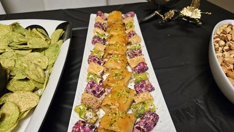 Cheese platter and bite size foods including sushi bar Stock Photos