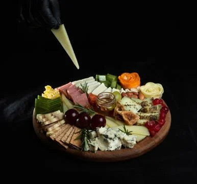 Cheese platter. Appetizers boards with assorted cheese, honey, dried figs a.. Stockfoto's