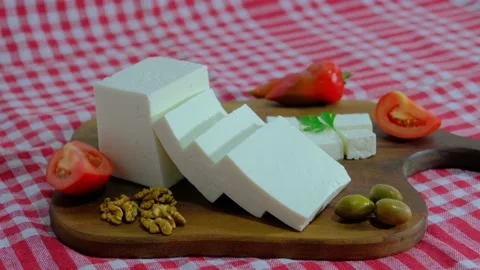 Cheese platter, Cubes of cheese, get cheese from plate. 4K UHD Video Stock Footage 220099633