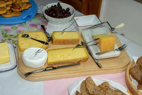 Cheese platter with different types of cheese Stock Photos