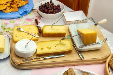 Cheese platter with different types of cheese Stock Photos