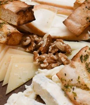 Cheese Platter with Grapes, Walnuts, and Toasted Bread Stock Photos