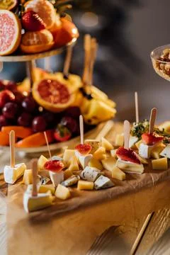 Cheese platter served with nuts and berries, a gourmet cheese decorated with  Stock Photos