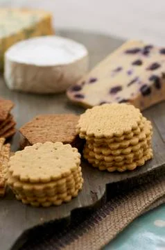 A cheese platter with various crackers Stock Photos