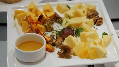 Cheese Platter With Walnuts, Grapes and Honey. Stock Footage 345781808
