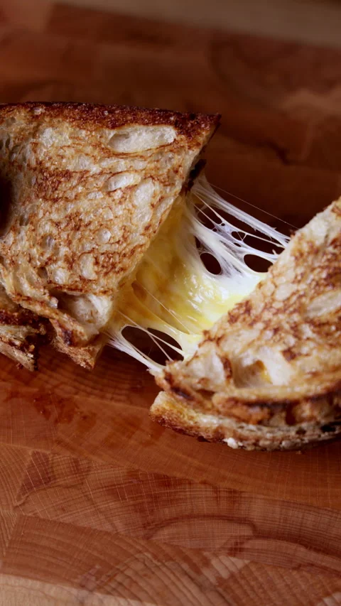 Cheese Pull from Grilled Cheese Sandwich Close Up Stockbeeldmateriaal 332546274