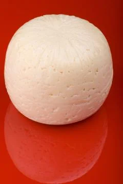 Cheese on red Stock Photos