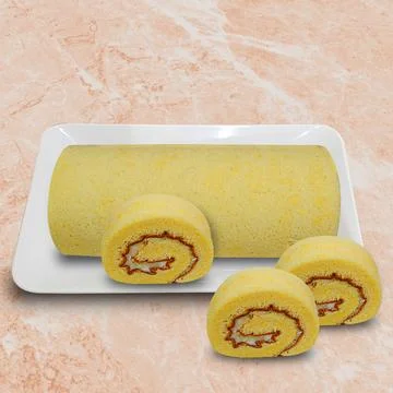 Cheese rolled sponge cake on a white plate Stock Photos