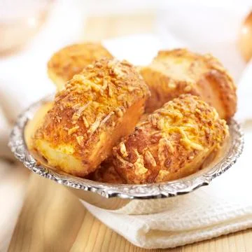 Cheese rolls on a silver plate Stock Photos