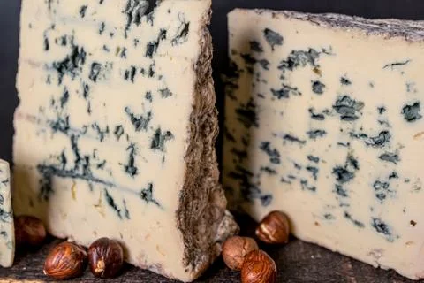 Cheese roquefort. Rustic closeup on soft black background. Healthy food Stock Photos