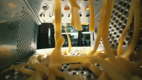 Cheese rubbed on a grater Stock Footage 198898372