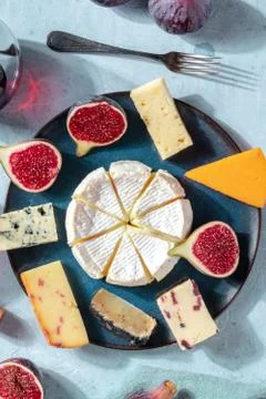 Cheese selection, overhead vertical shot on a plate with fresh figs 写真素材