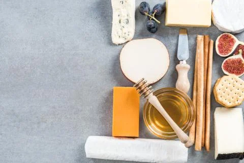 Cheese selection top view on stone slate Stock Photos