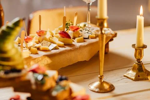 Cheese selection on wooden rustic board. Cheese platter with different cheese Stock Photos
