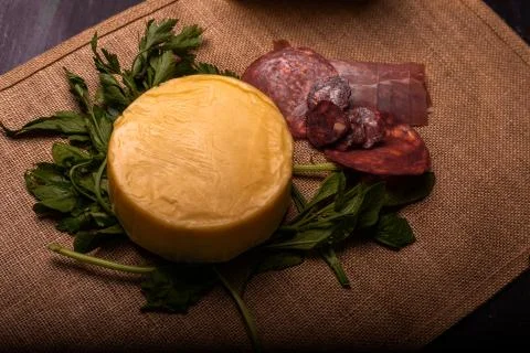 Cheese with serrano ham, olives on a table for a party with friends or as an  Foto stock