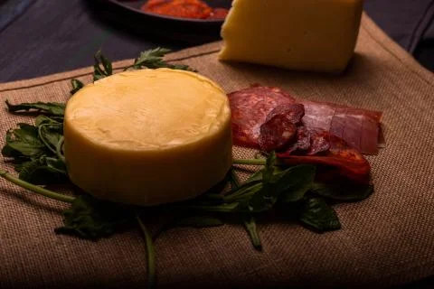 Cheese with serrano ham, olives on a table for a party with friends or as an  Stock Photos